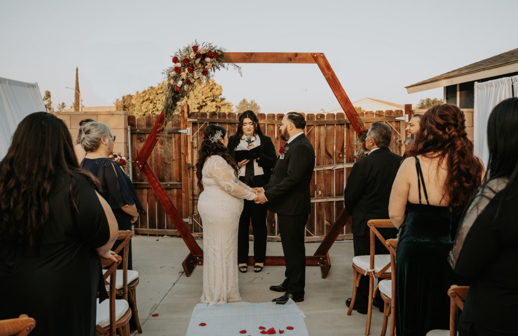 Intimate backyard wedding in the fall with beautiful octagon shaped backdrop. Southern California Wedding Photographer. 