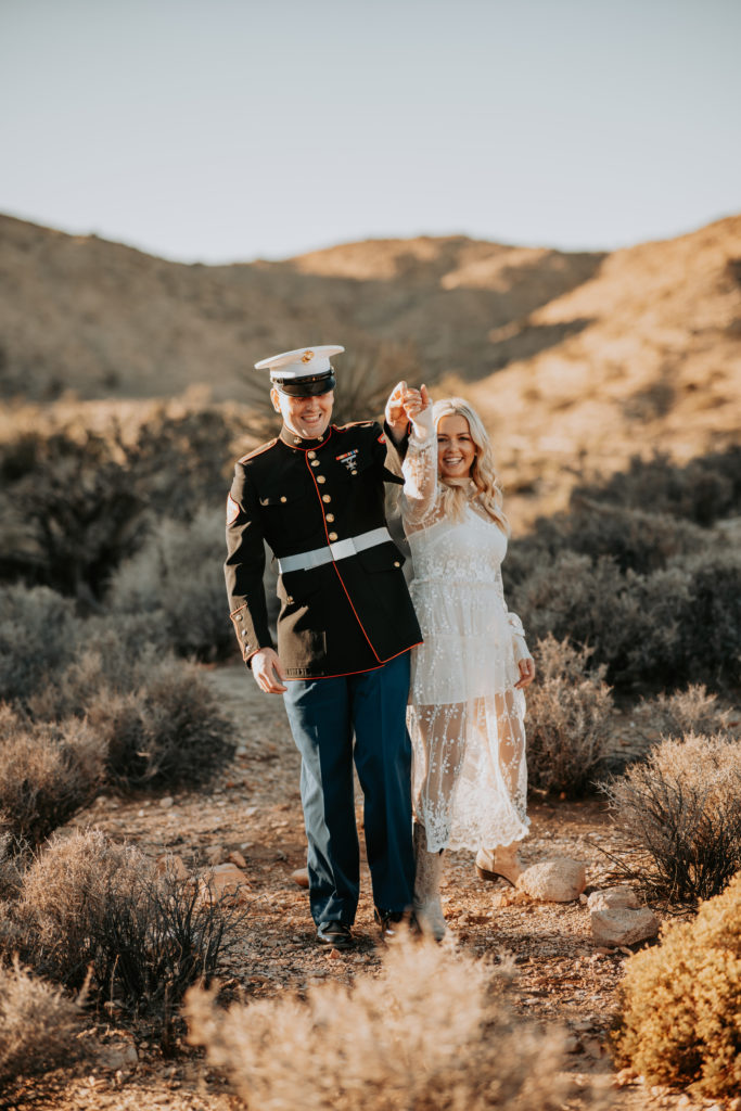 couple walking in joshua tree during engagement session