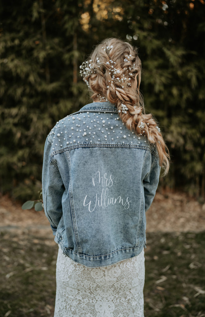 photos of bride holding neutral wedding flowers and wearing jean jacket