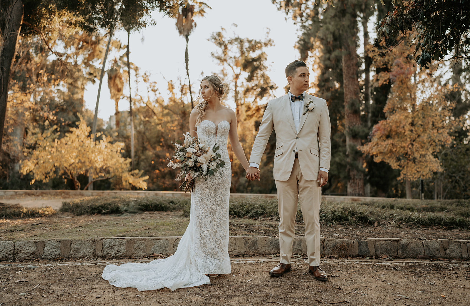 bride and groom holding hands at wedding