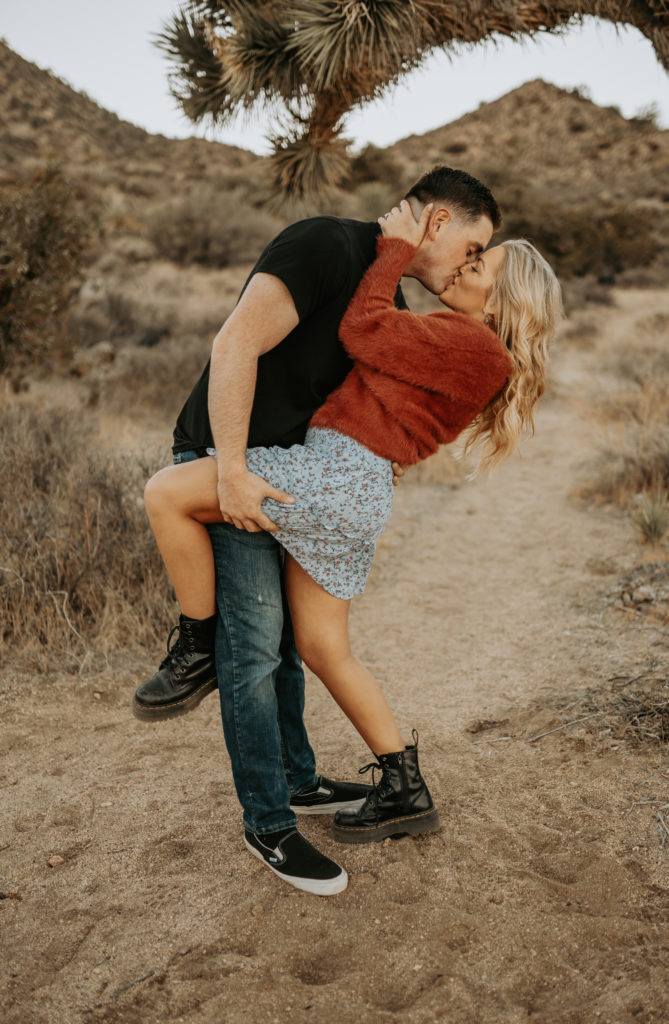 couple dancing in joshua tree during engagement session