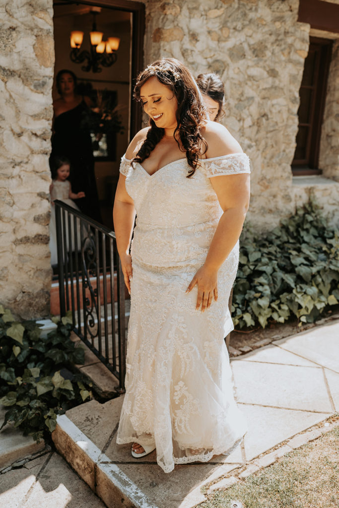 Bride on her wedding day in lace wedding dress
