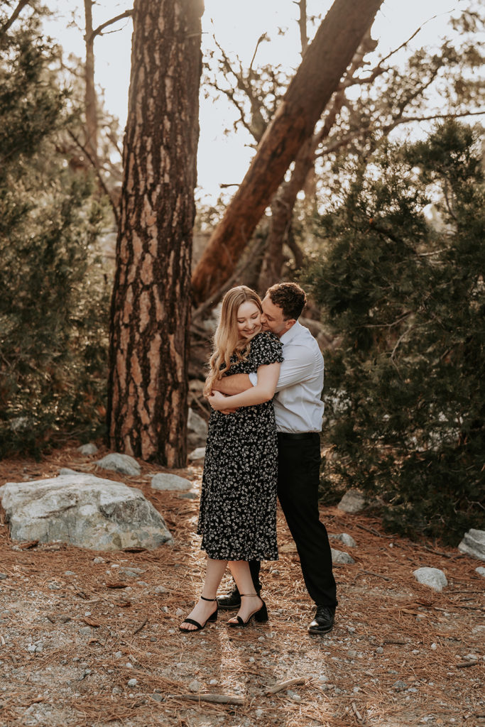 couple posing in California forest for  photos