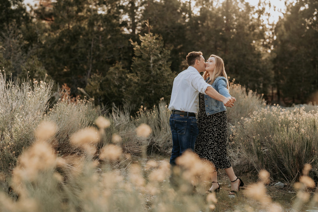 couple posing in California forest for  photos