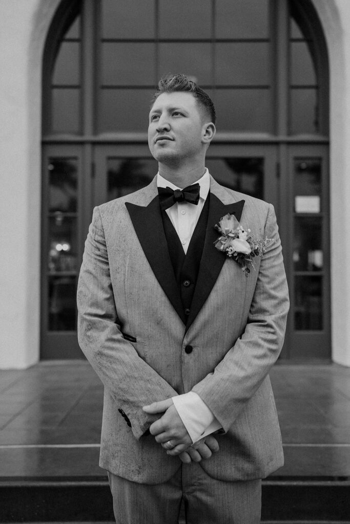 groom posing for his wedding portraits