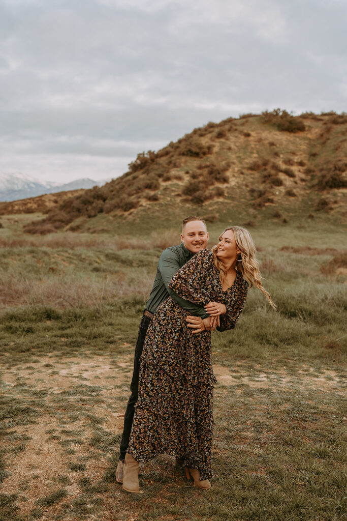 couple posing for their engagement photoshoot in redlands california