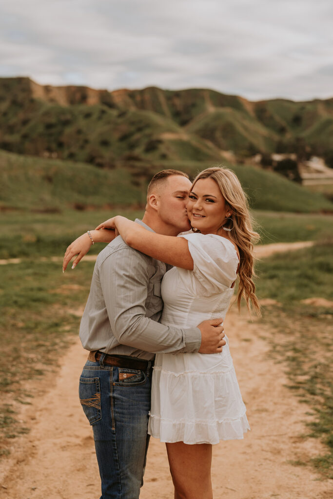 couple posing for their engagement photoshoot in redlands california