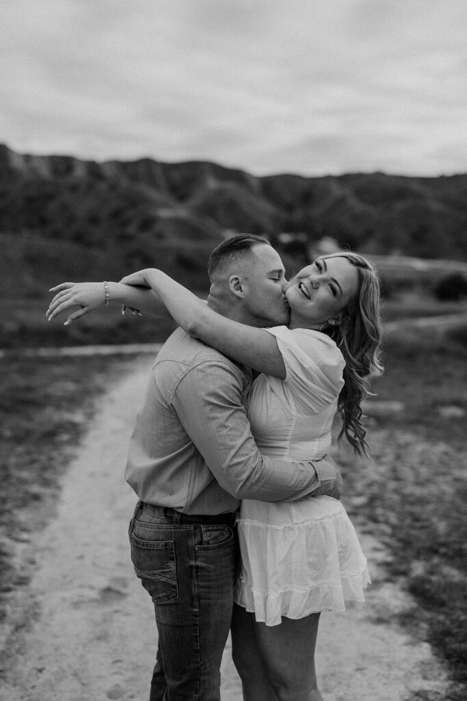 couple posing for their engagement photoshoot in redlands california