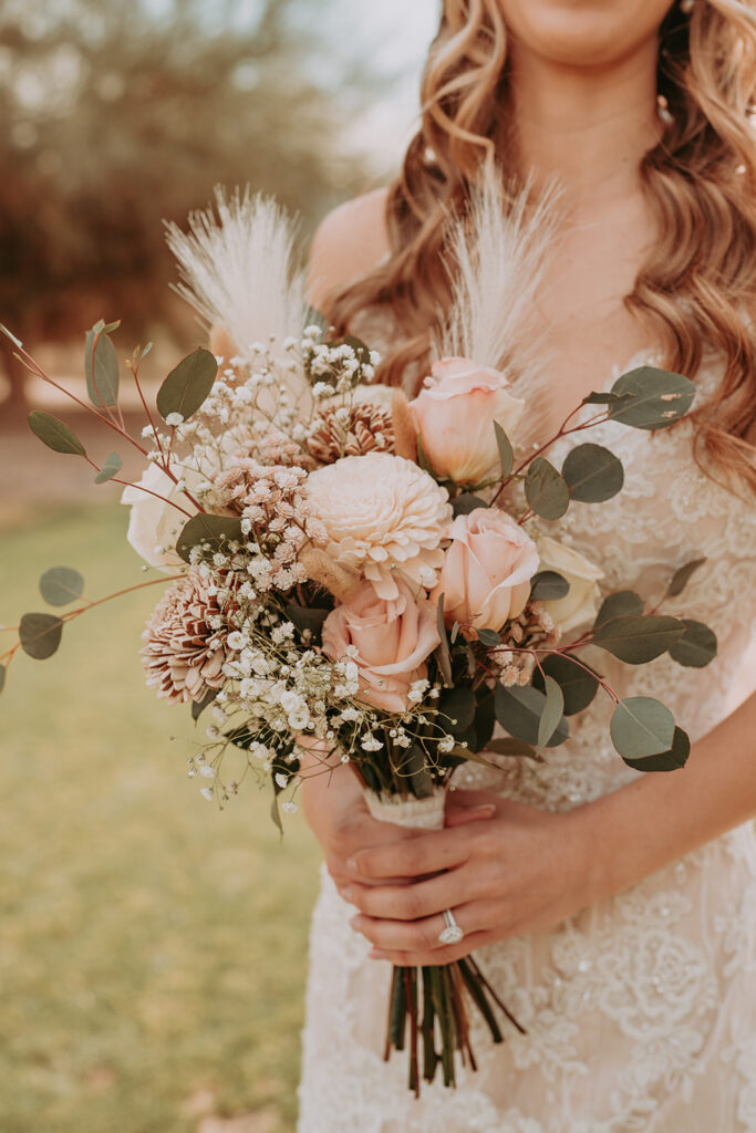 bride posing with bouquet