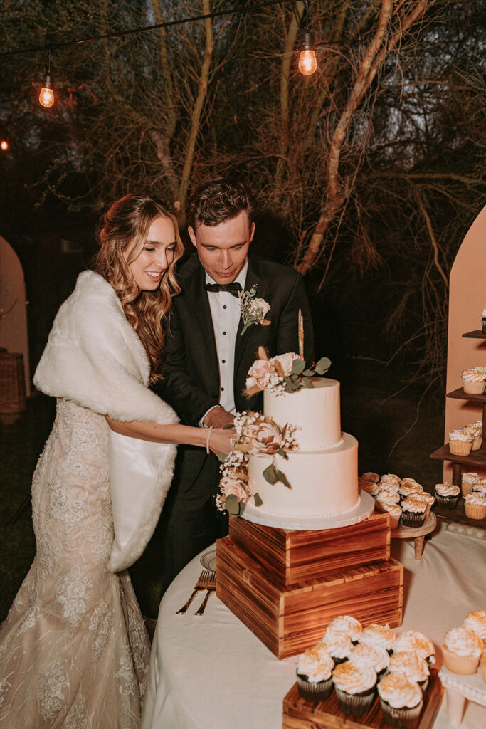 couple eating their wedding cake