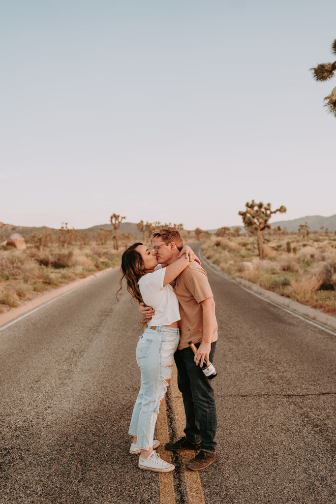 couple posing in joshua tree for their engagement photos