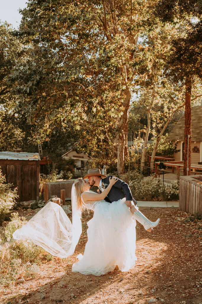 Wedding couple kissing outdoors

