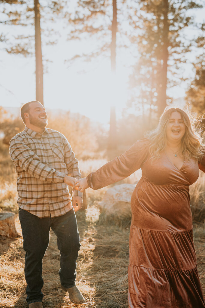 couple laughing for fall engagement session