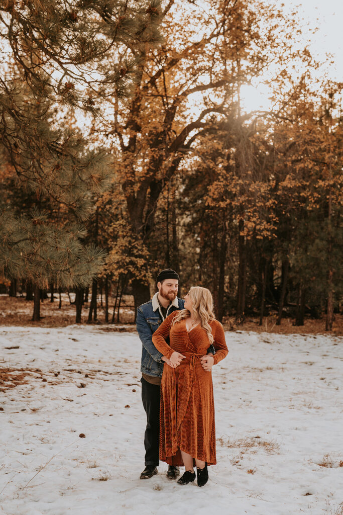 couple standing for fall mountain engagement session