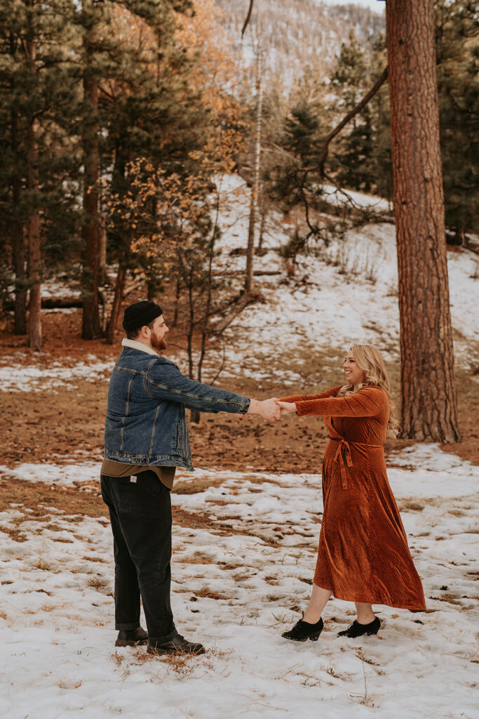 couple dancing for fall mountain engagement session