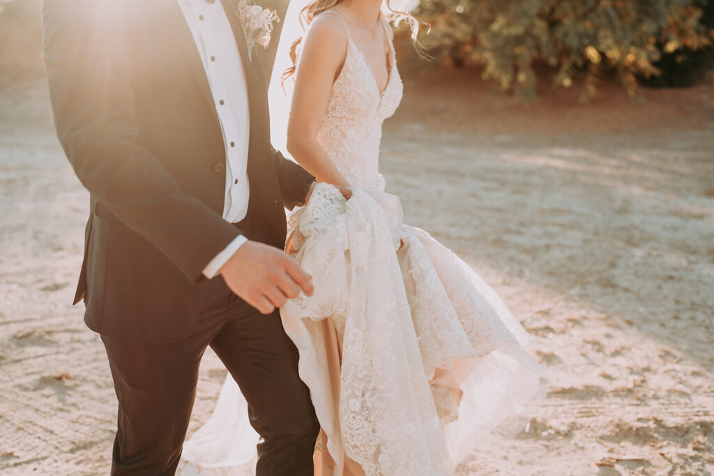 Wedding couple walking in the sunset