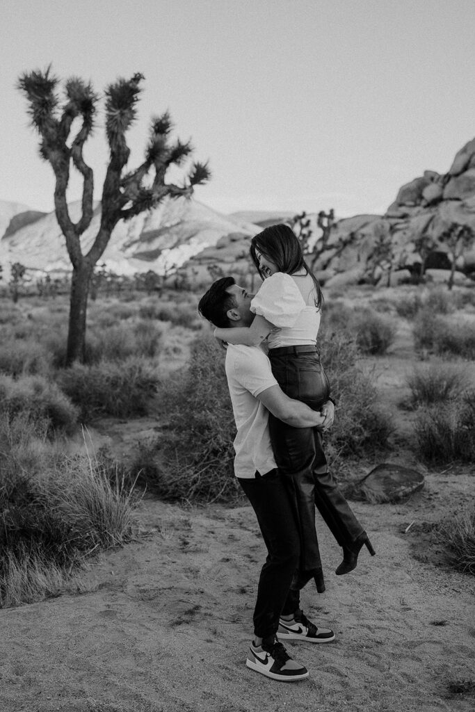 black and white fall couple engagement photo pose dancing