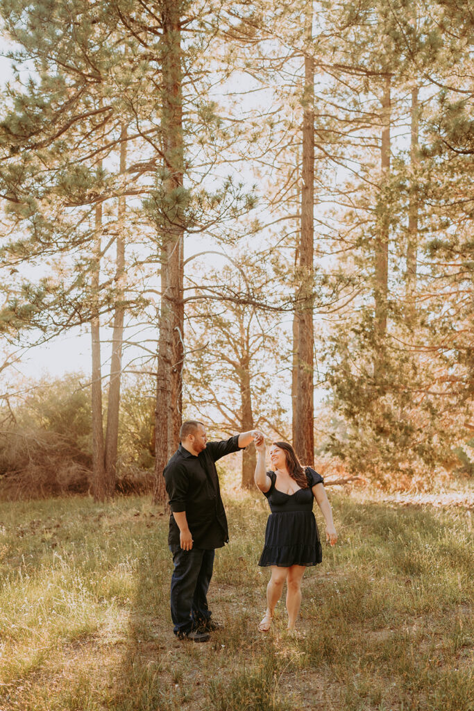 fall couple engagement photo pose dancing