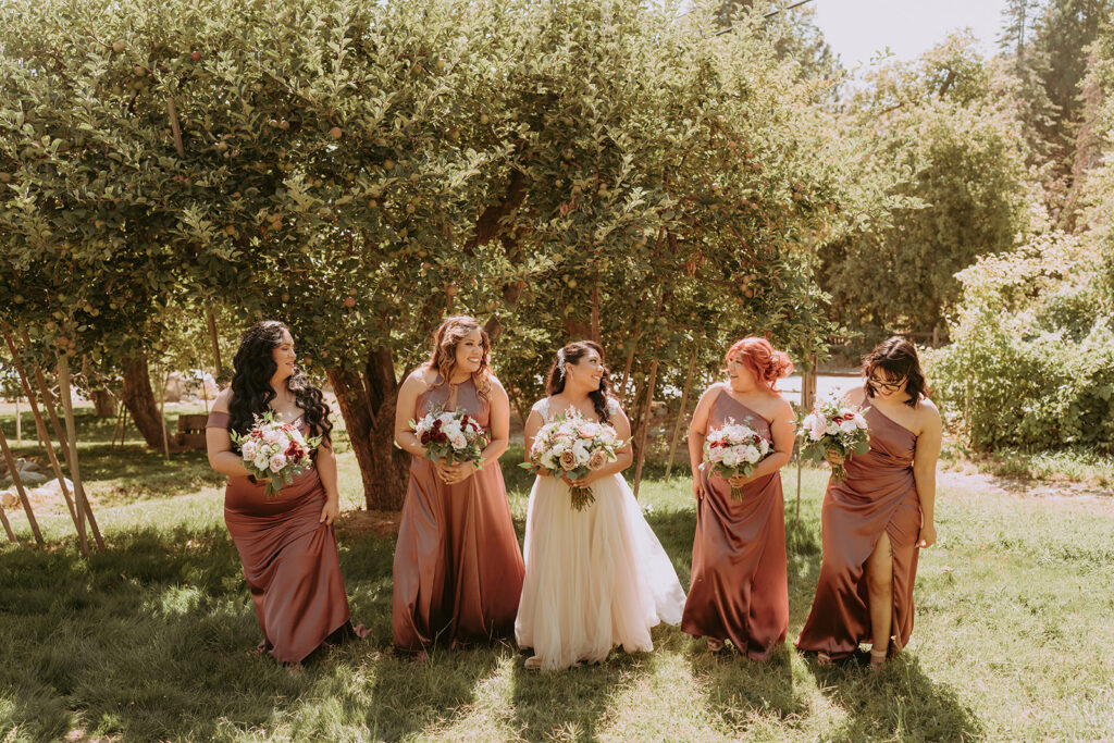 Bride walking with Bridesmaids outside