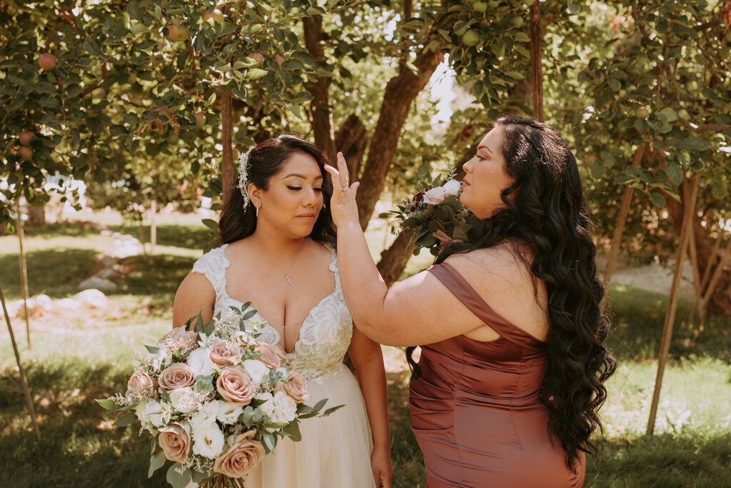 Bride with Bridesmaid outside