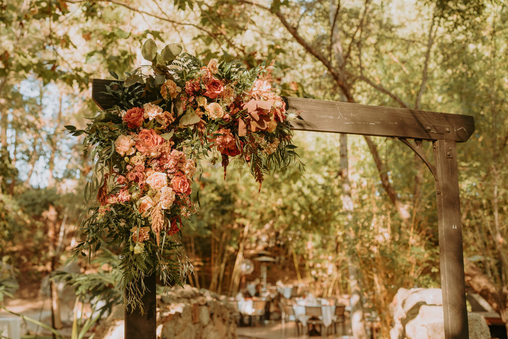 wedding arch with greenery and florals