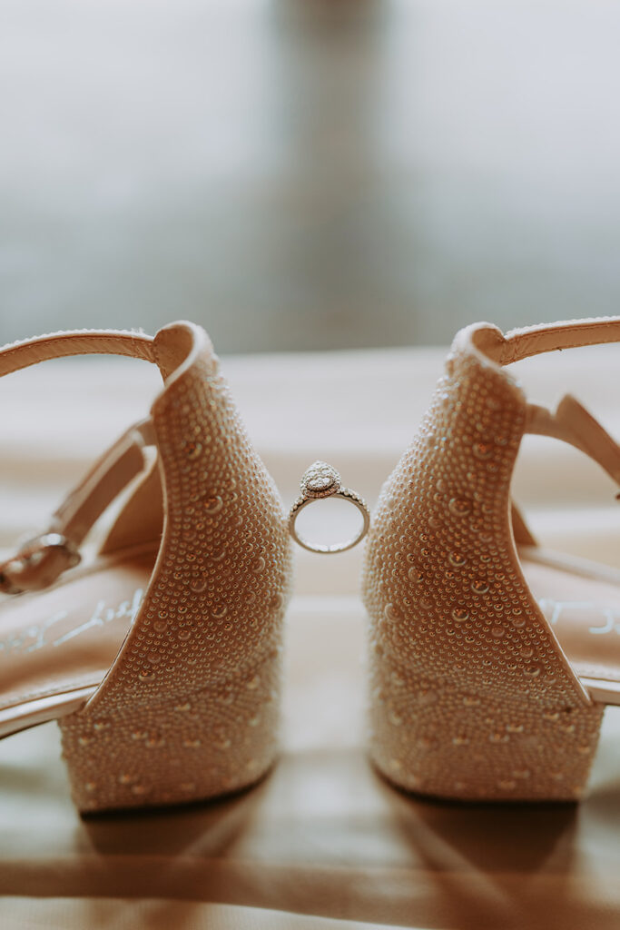 white bridal heels and ring 
