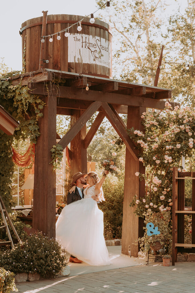 bride and groom kissing at a southern California wedding venue in Oak Glen
