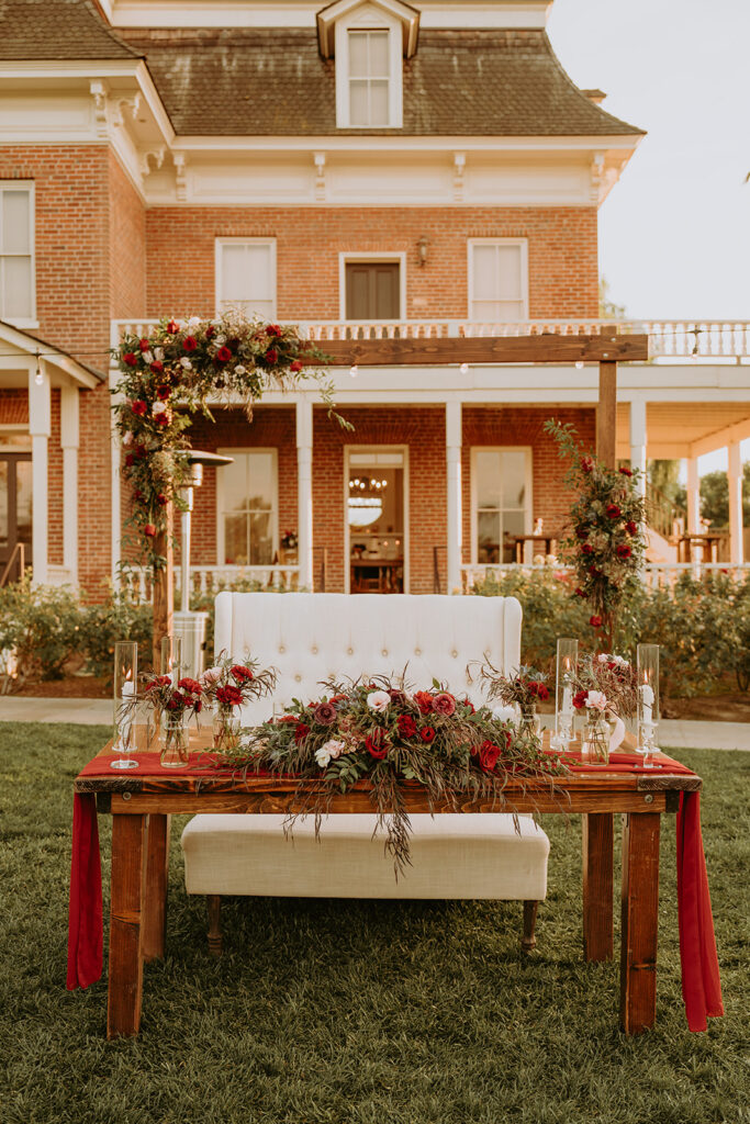 head table with florals at a Redlands wedding venue