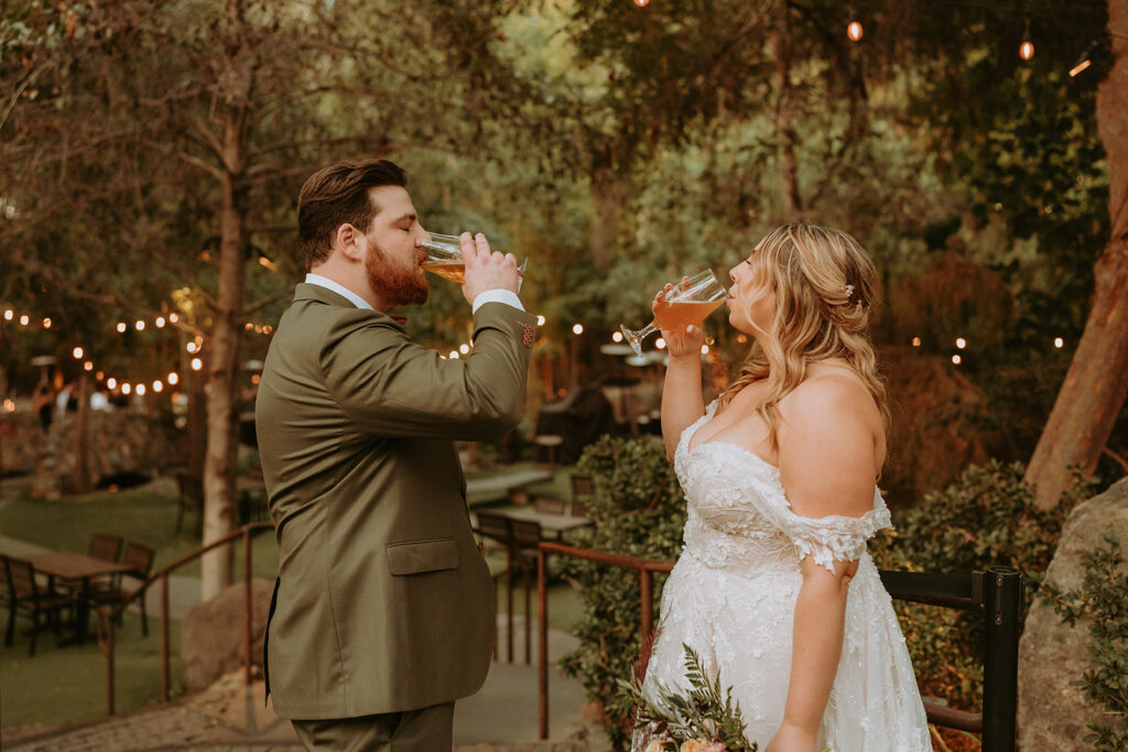 bride and groom drinking beers