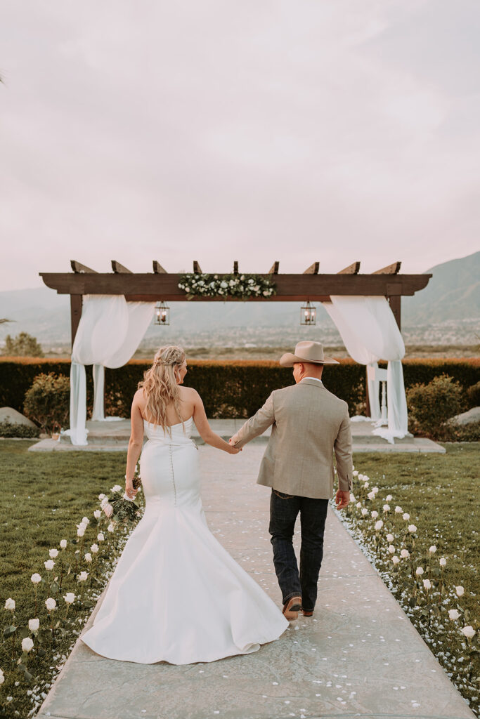 Southern California redlands wedding venue bride and groom walking away