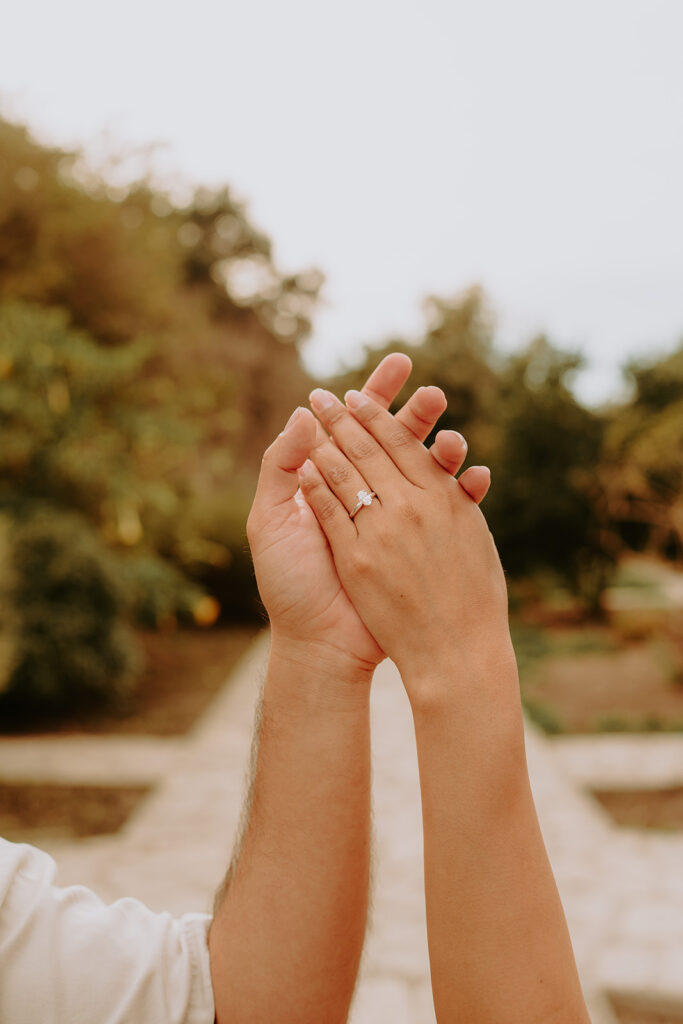 couple's hands with an engagement ring 