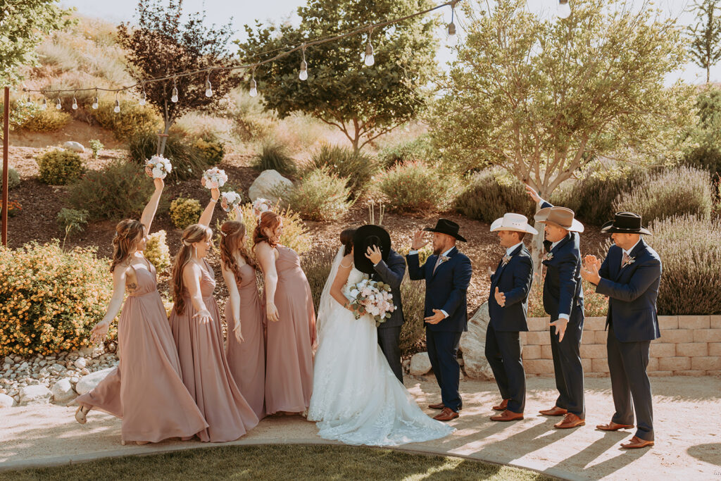 Bride and groom with wedding party at windmill canyon ranch