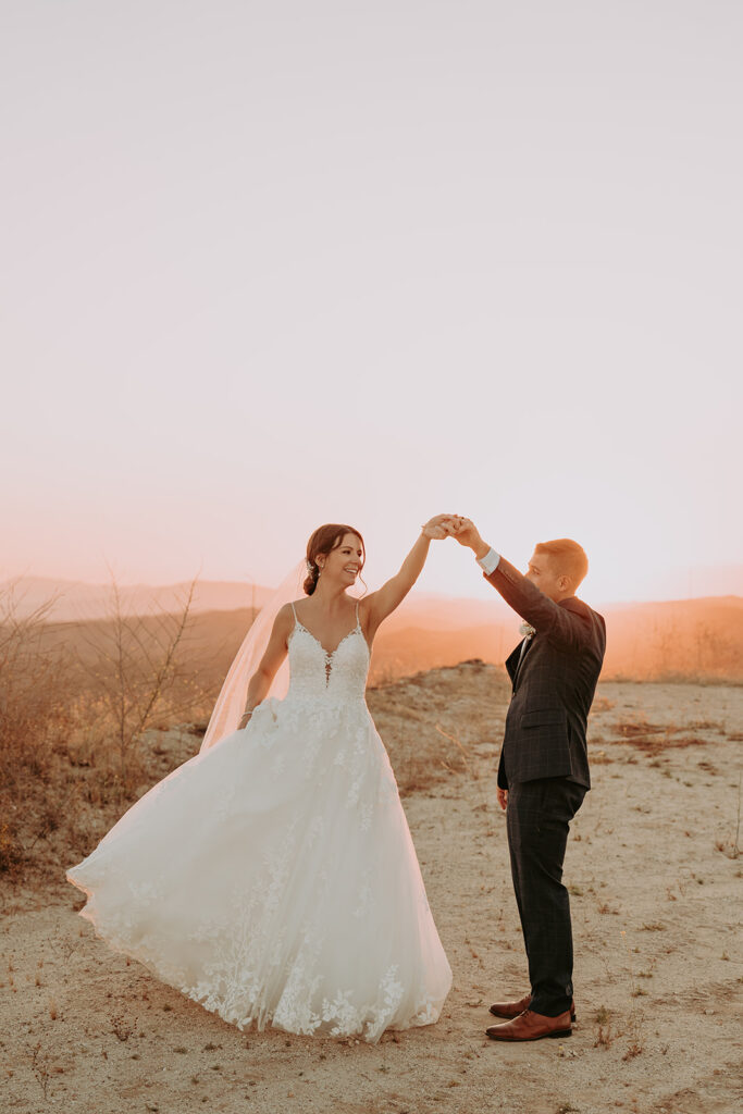bride and groom dancing during sunset photos at windmill canyon ranch