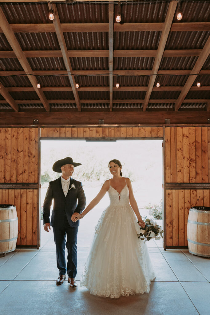 bride and groom dancing in a barn at windmill canyon ranch