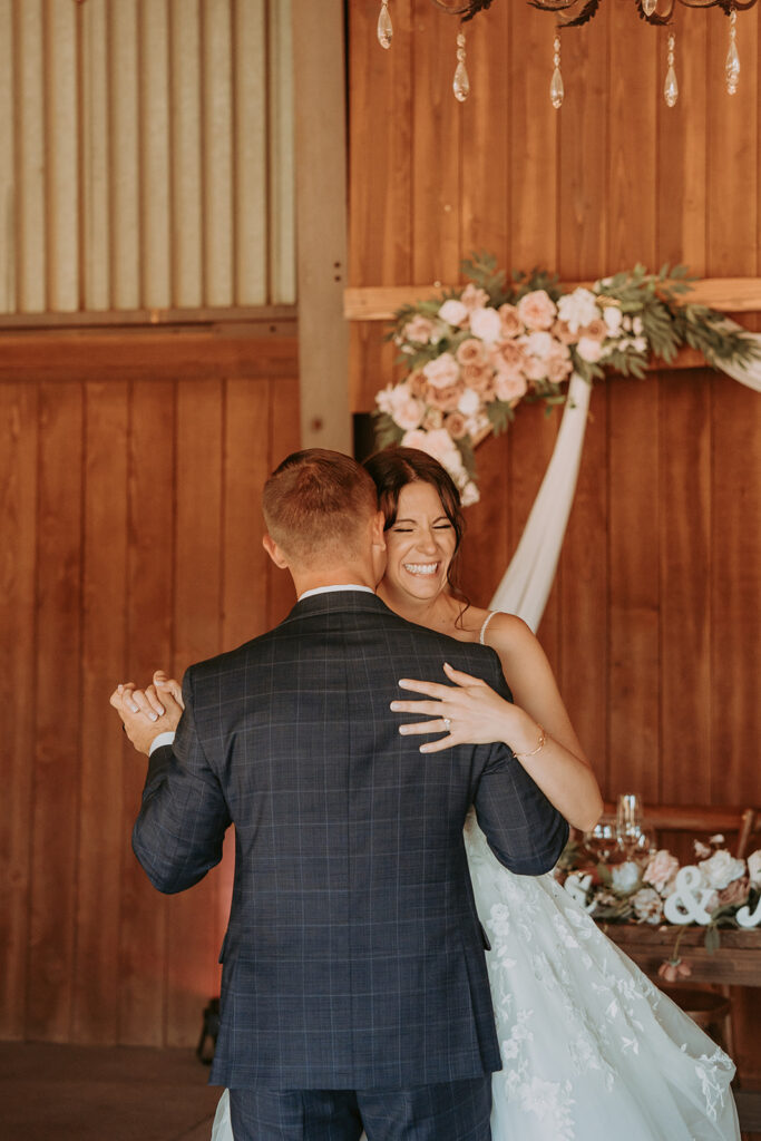 bride and groom dancing in a barn at windmill canyon ranch