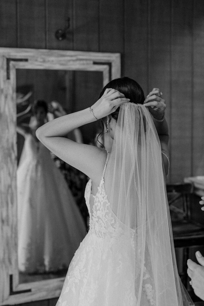 bride putting on her veil
