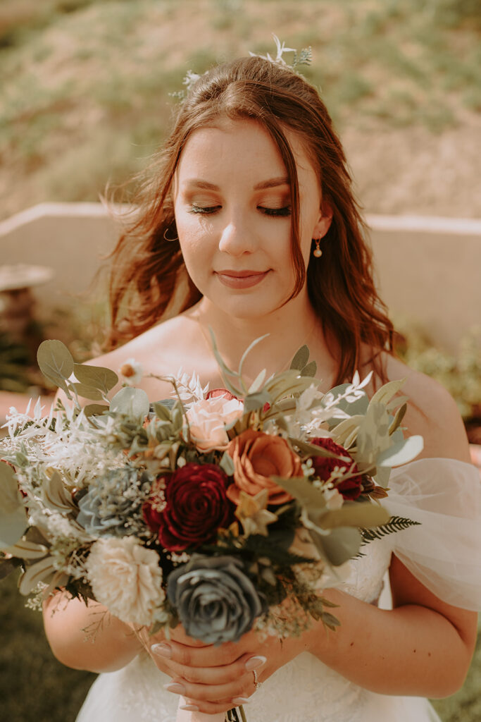 bride posing with her bouquet
