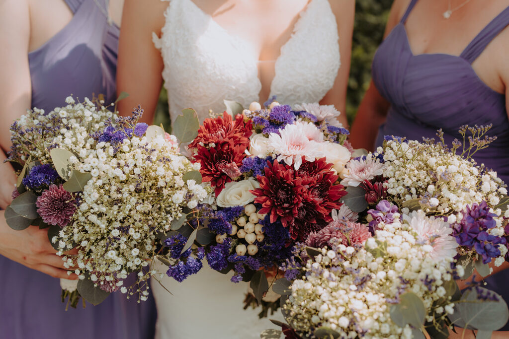 close up of bride and bridal party flowers