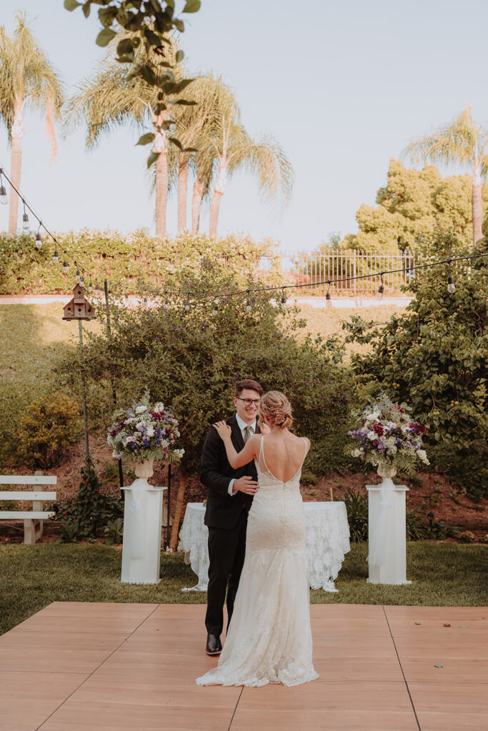 bride and groom in a backyard wedding reception