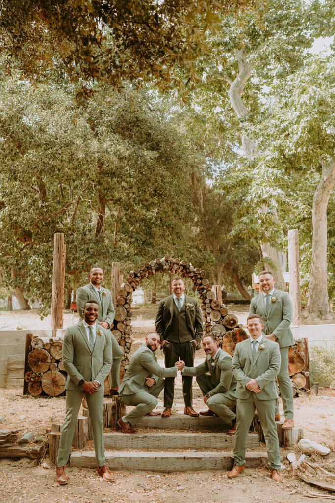 groom and groomsmen standing at an oak glen wedding venue