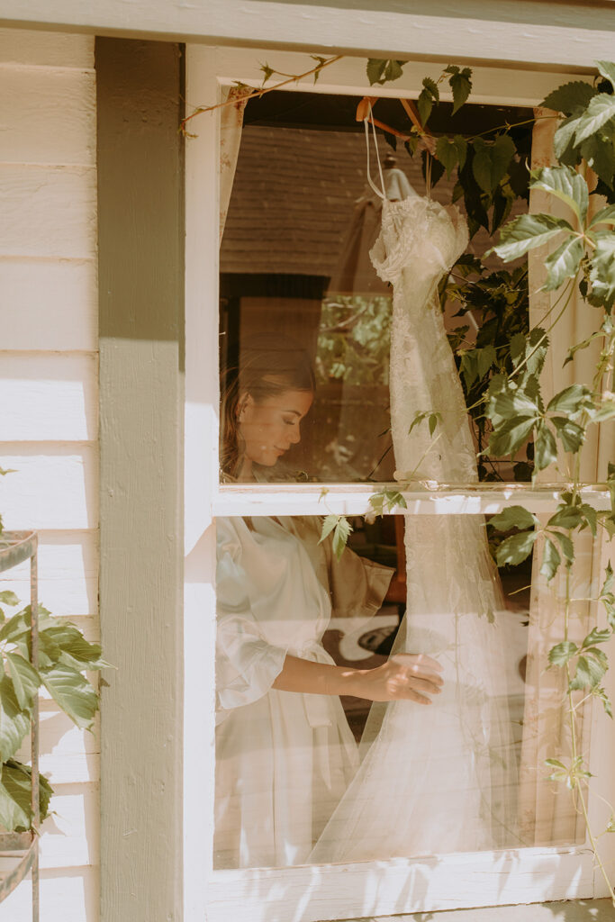 a bride posing with her wedding dress 