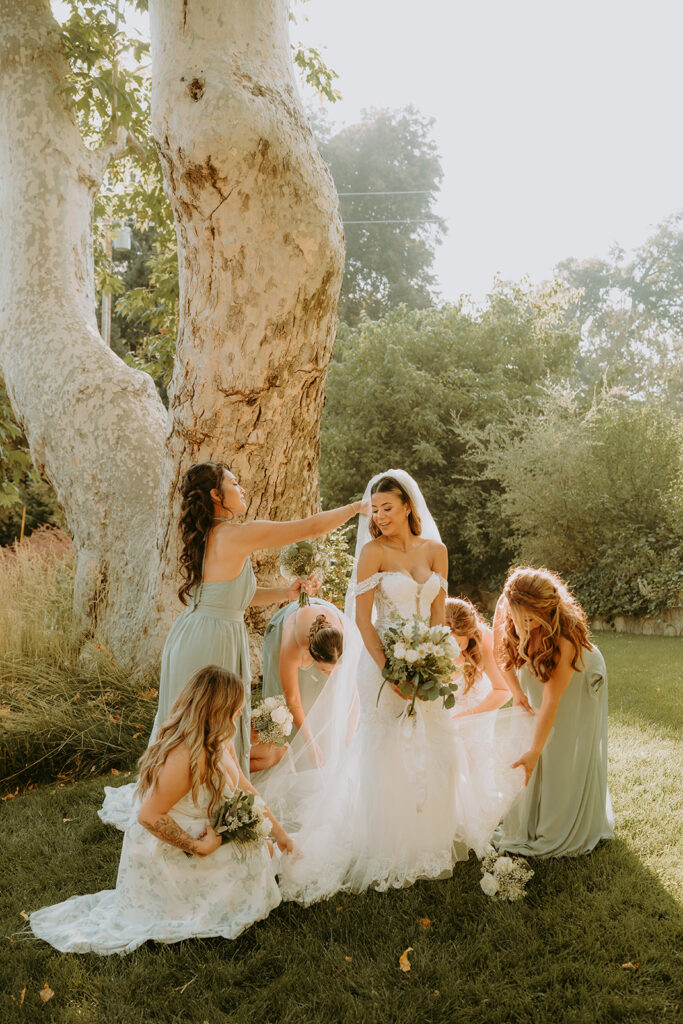 bride laughing with her bridesmaids at an oak glen wedding venue