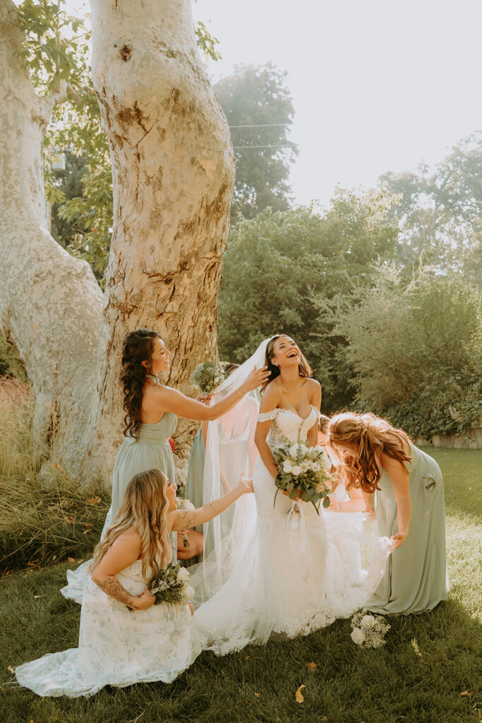 bride laughing with her bridesmaids at an oak glen wedding venue