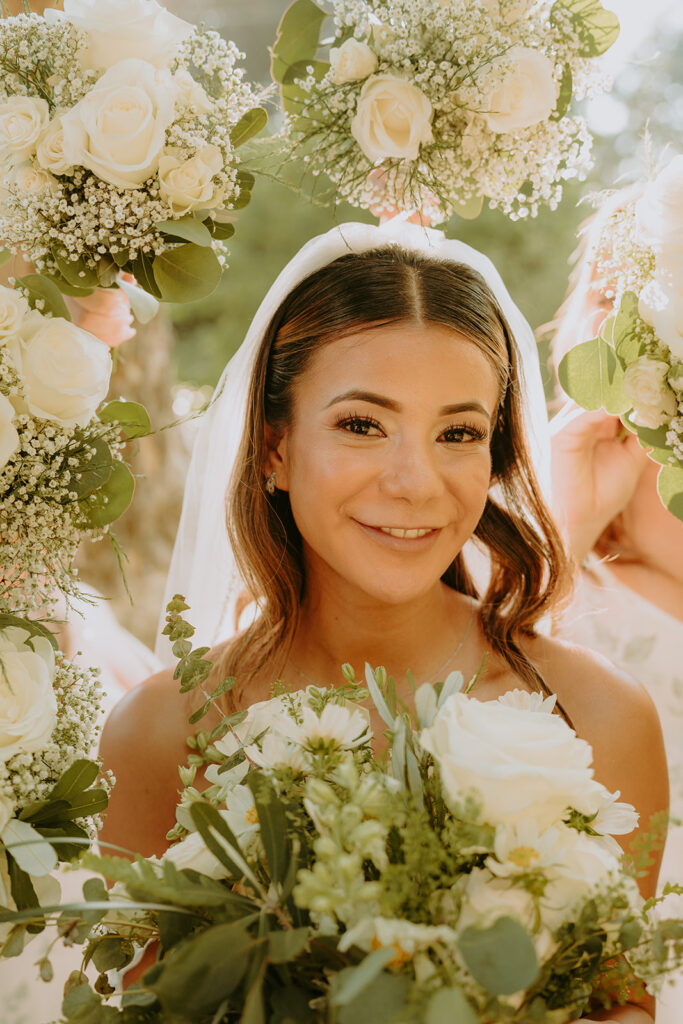 portrait of a bride outside with her bouquet