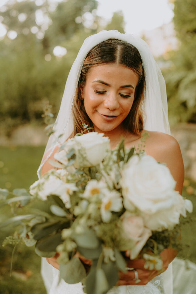 portrait of a bride outside with her bouquet