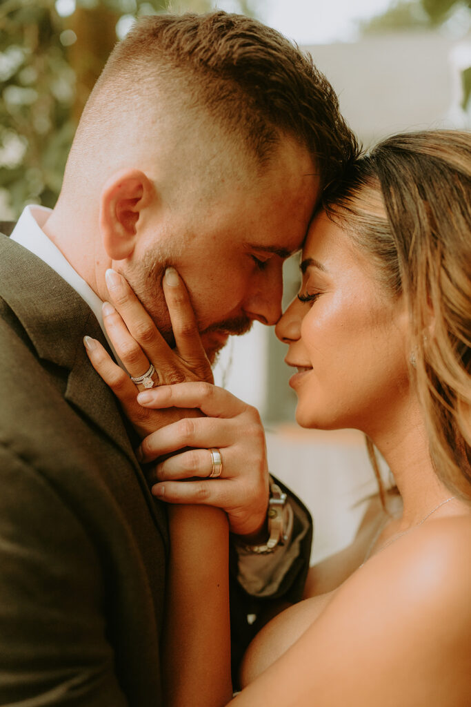 close up of a bride and groom about to kiss