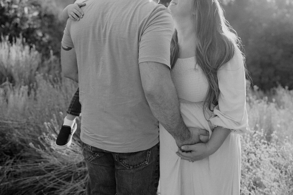 Fall maternity session in the Southern California mountains during golden hour, featuring warm autumn tones and stunning mountain views