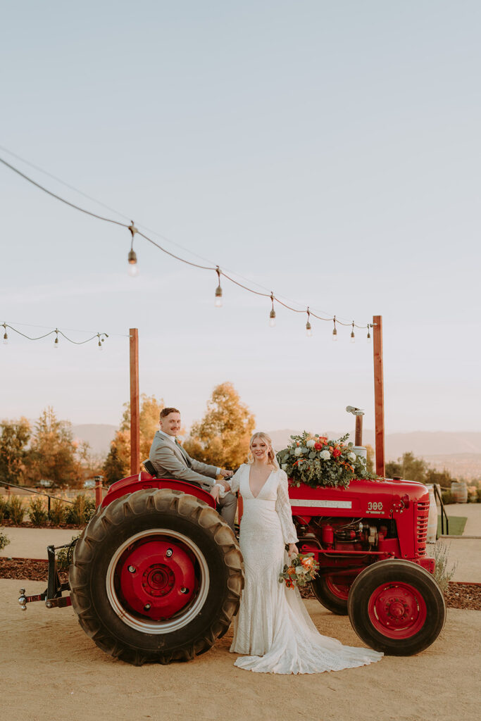Rustic tractor shuttle at Sacred Oak Vineyard, a unique transportation option for wedding guests.