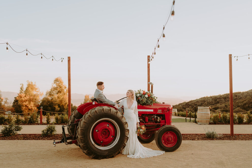 Rustic tractor shuttle at Sacred Oak Vineyard, a unique transportation option for wedding guests.