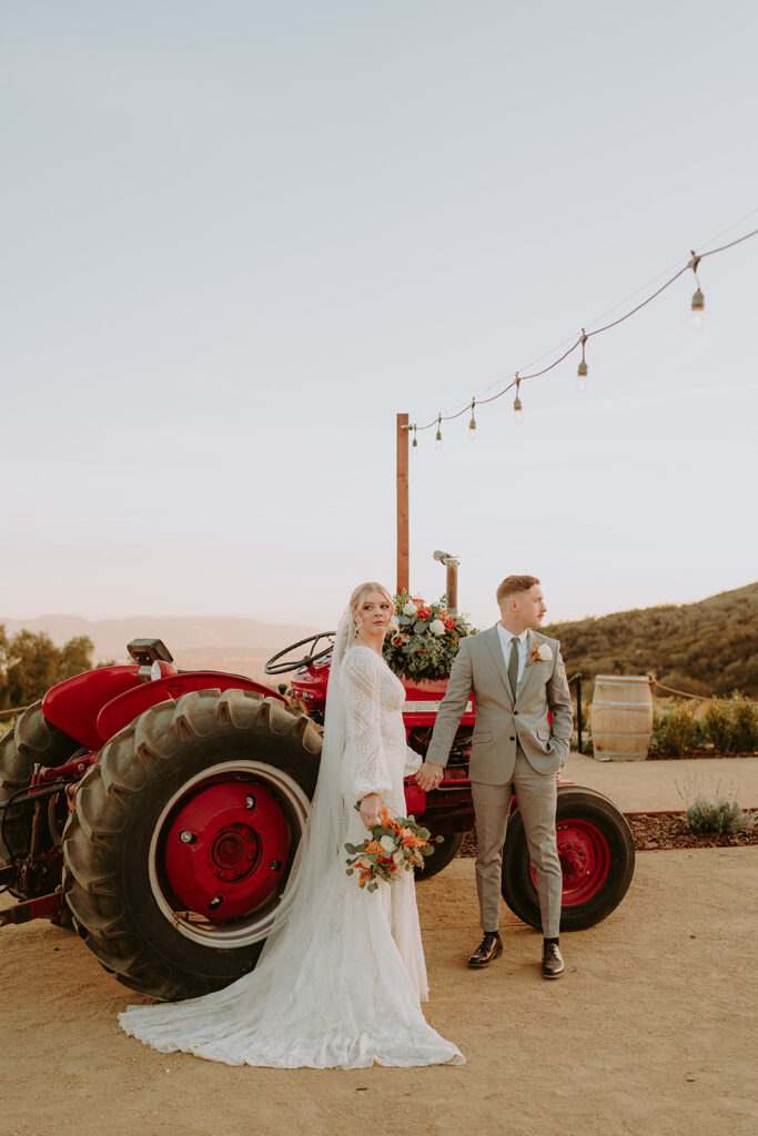 Rustic tractor shuttle at Sacred Oak Vineyard, a unique transportation option for wedding guests.